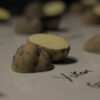 yukon gold potato cut in half on a whiteboard